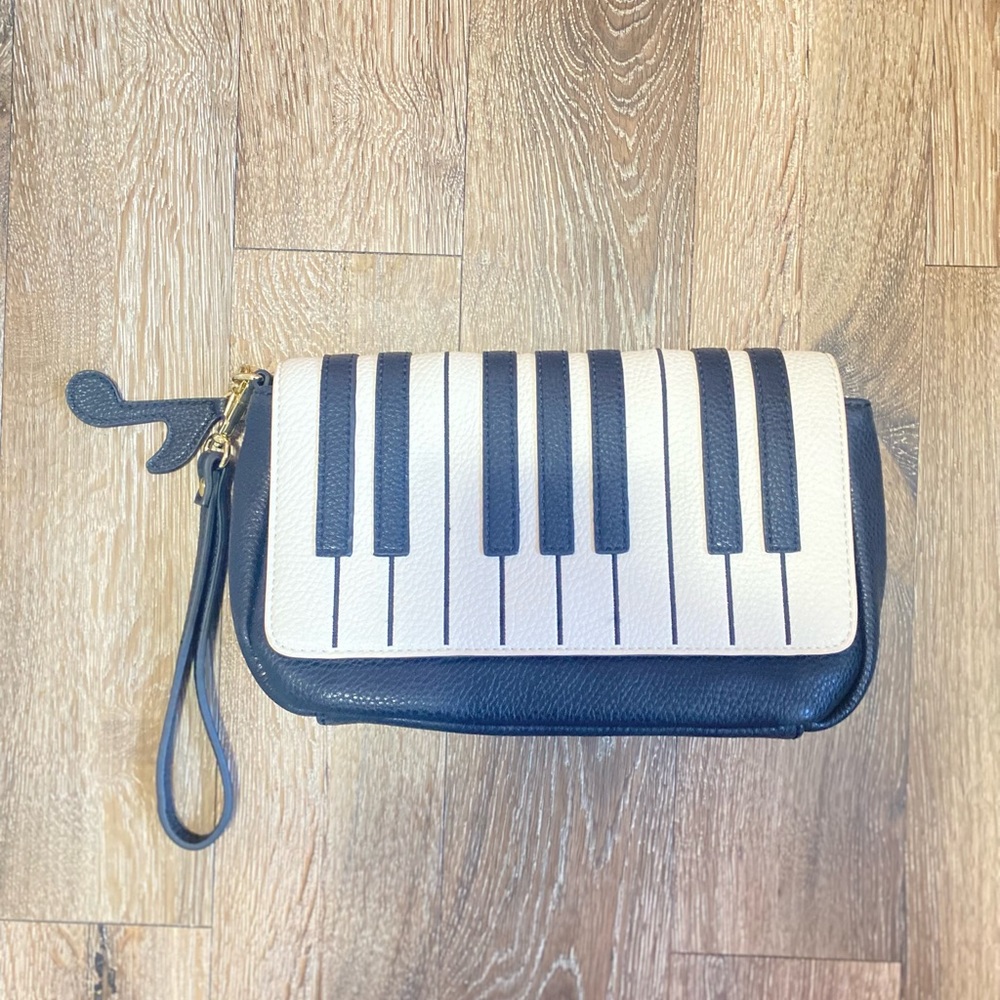 Piano clutch purse with music note clip. Never used!